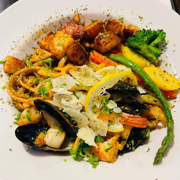 Viney's Italian Kitchen's seafood pasta with mussels, shrimp, scallops, roasted potatoes, and vegetables.